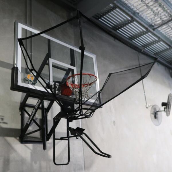 Wall-mounted basketball hoop with a ball return net at Carbon Gym Geelong
