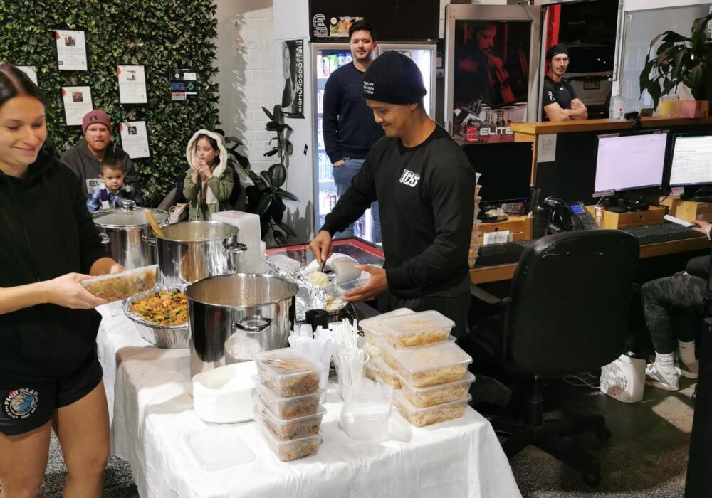 Members serving and sharing home-cooked Thai food at a community meal fundraiser at Carbon Gym Geelong