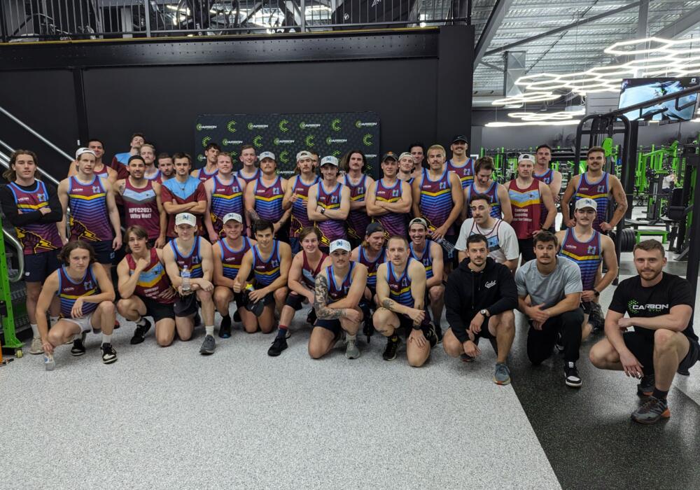 Local football club team gathered on the strength floor after a group training session at Carbon Gym Geelong