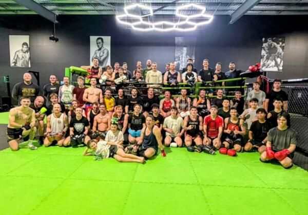 Large group of Muay Thai members and fighters gathered on the mats after training at Carbon Gym Geelong