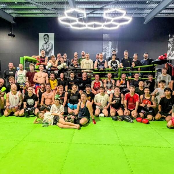 Large group of Muay Thai members and fighters gathered on the mats after training at Carbon Gym Geelong