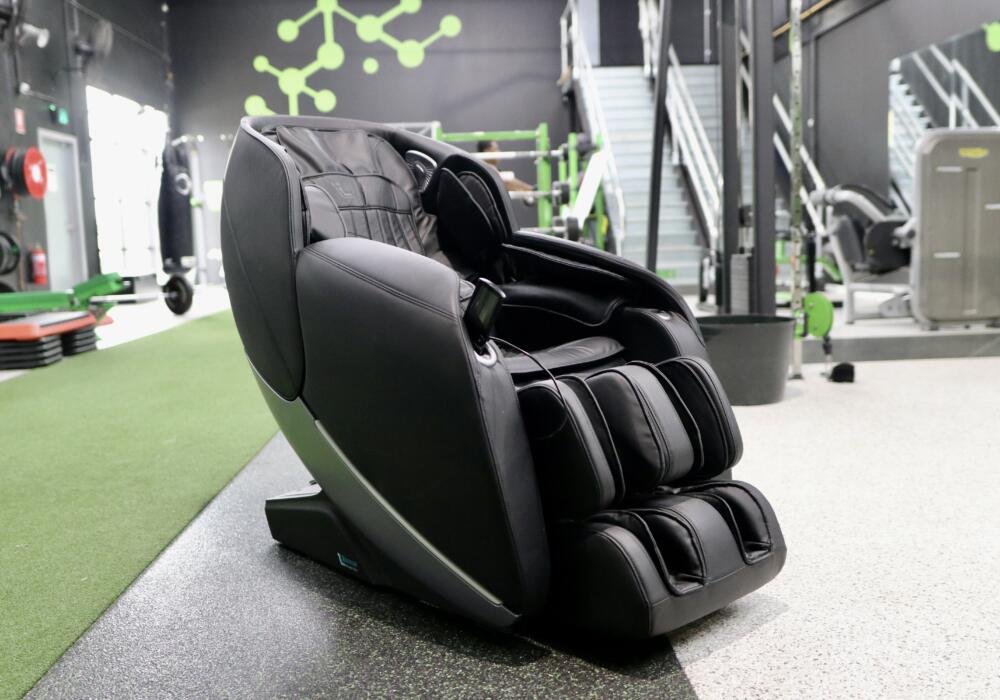 Physio+ Massage Chair at Carbon Gym Geelong featuring 4D massage rollers, zero gravity recline, and heated therapy functions for post-workout recovery.