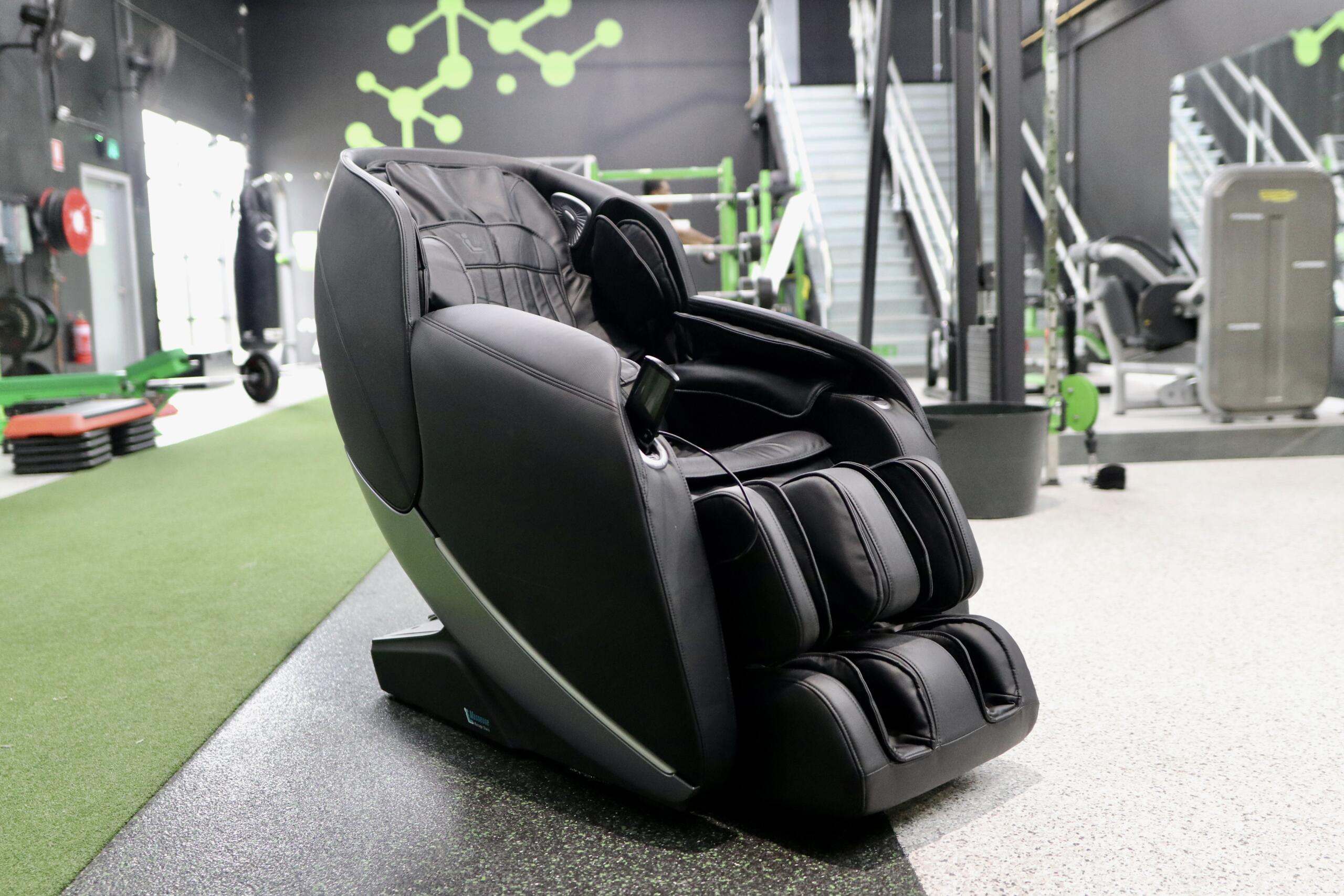 Physio+ Massage Chair at Carbon Gym Geelong featuring 4D massage rollers, zero gravity recline, and heated therapy functions for post-workout recovery.