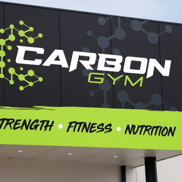 Carbon Gym exterior sign in Norlane Geelong featuring the carbon molecule logo and Strength Fitness Nutrition tagline