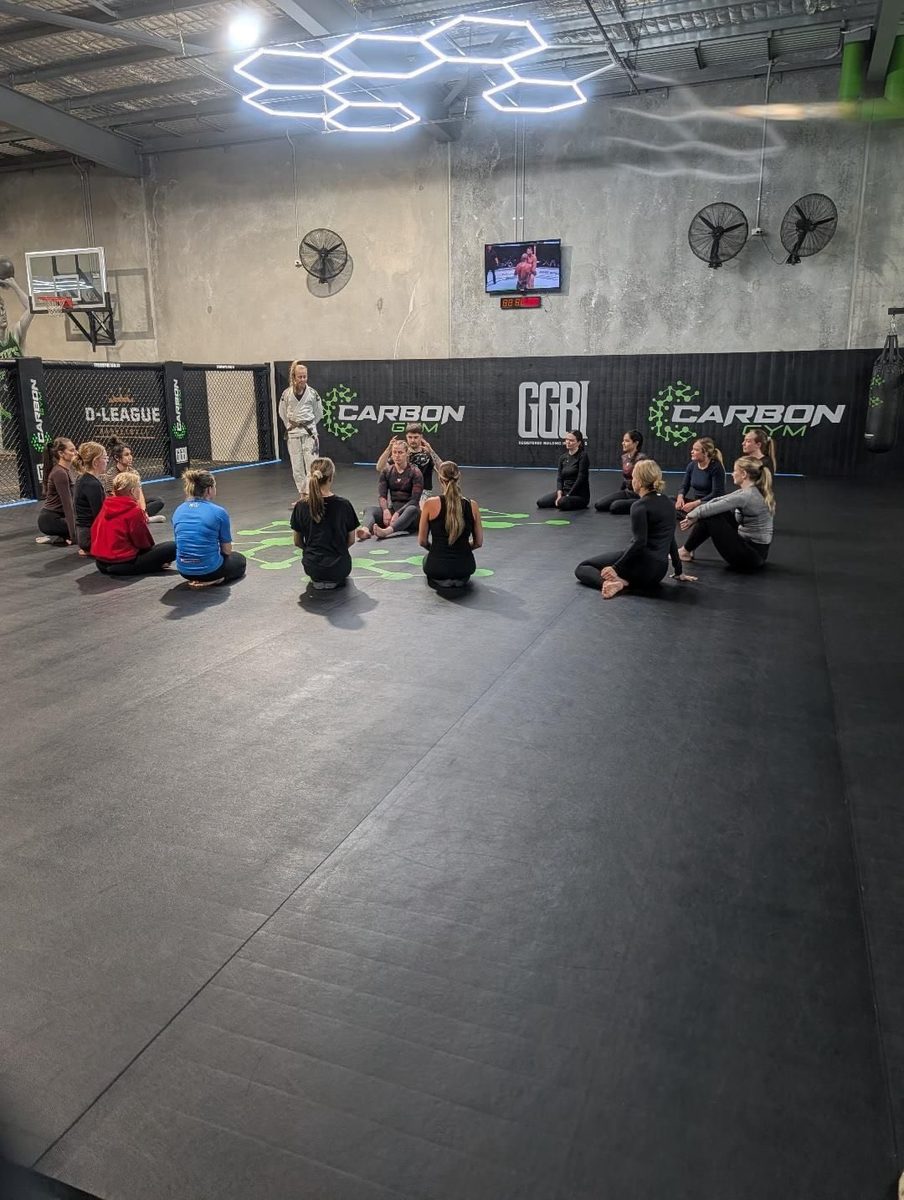 Group of women seated in a circle during a ladies-only BJJ class at Carbon Gym in North Geelong