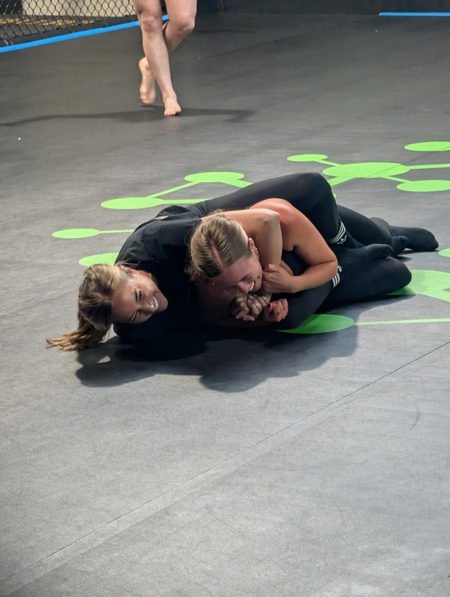 Two women drilling BJJ back control on the mats at a ladies-only class in North Geelong