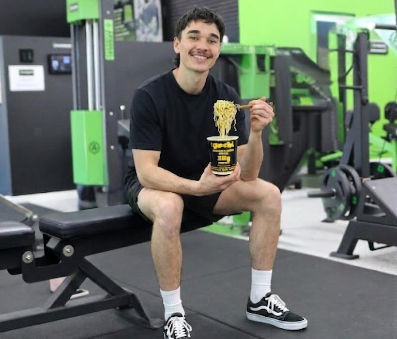 Weight management Geelong: Carbon Gym member refuelling with a high-protein noodle cup after training