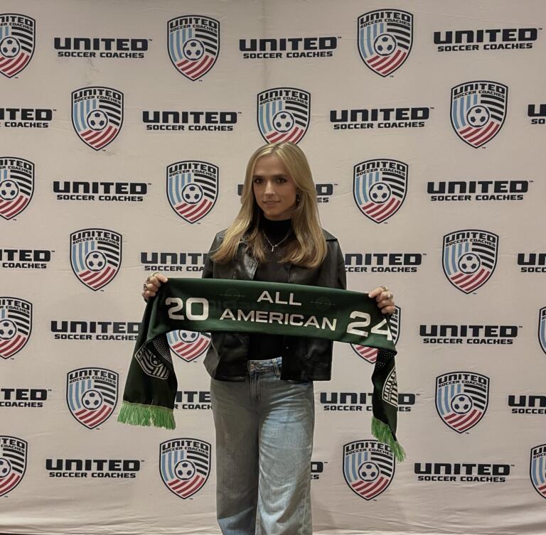 Heidi Harris holding her 2024 United Soccer Coaches All-American scarf