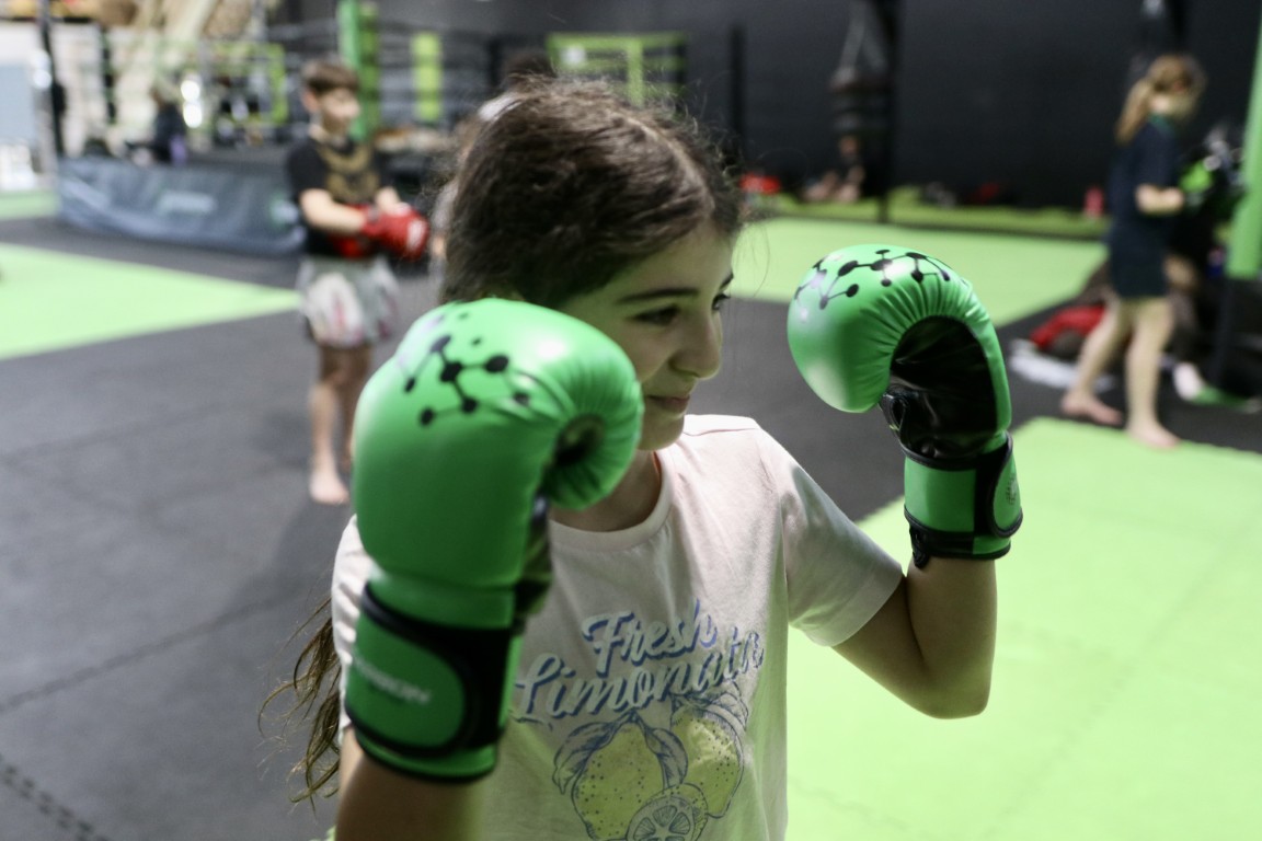 Member-wearing-kids-gloves