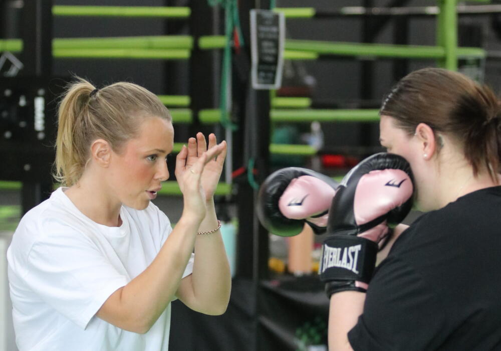 Choosing an NDIS gym in Geelong: participant training with a Carbon Gym coach on focus pads