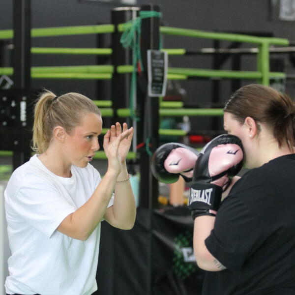 Choosing an NDIS gym in Geelong: participant training with a Carbon Gym coach on focus pads
