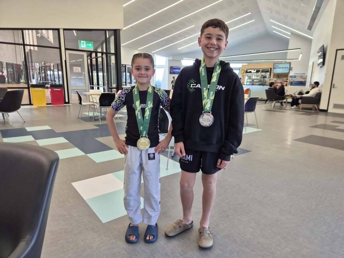 Two young Carbon Gym kids BJJ competitors showing gold and silver medals from the Regional Victoria Jiu Jitsu Championships