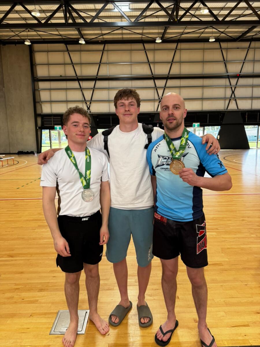 Three Carbon Gym team members holding BJJ medals after the Regional Victoria Jiu Jitsu Championships in Torquay